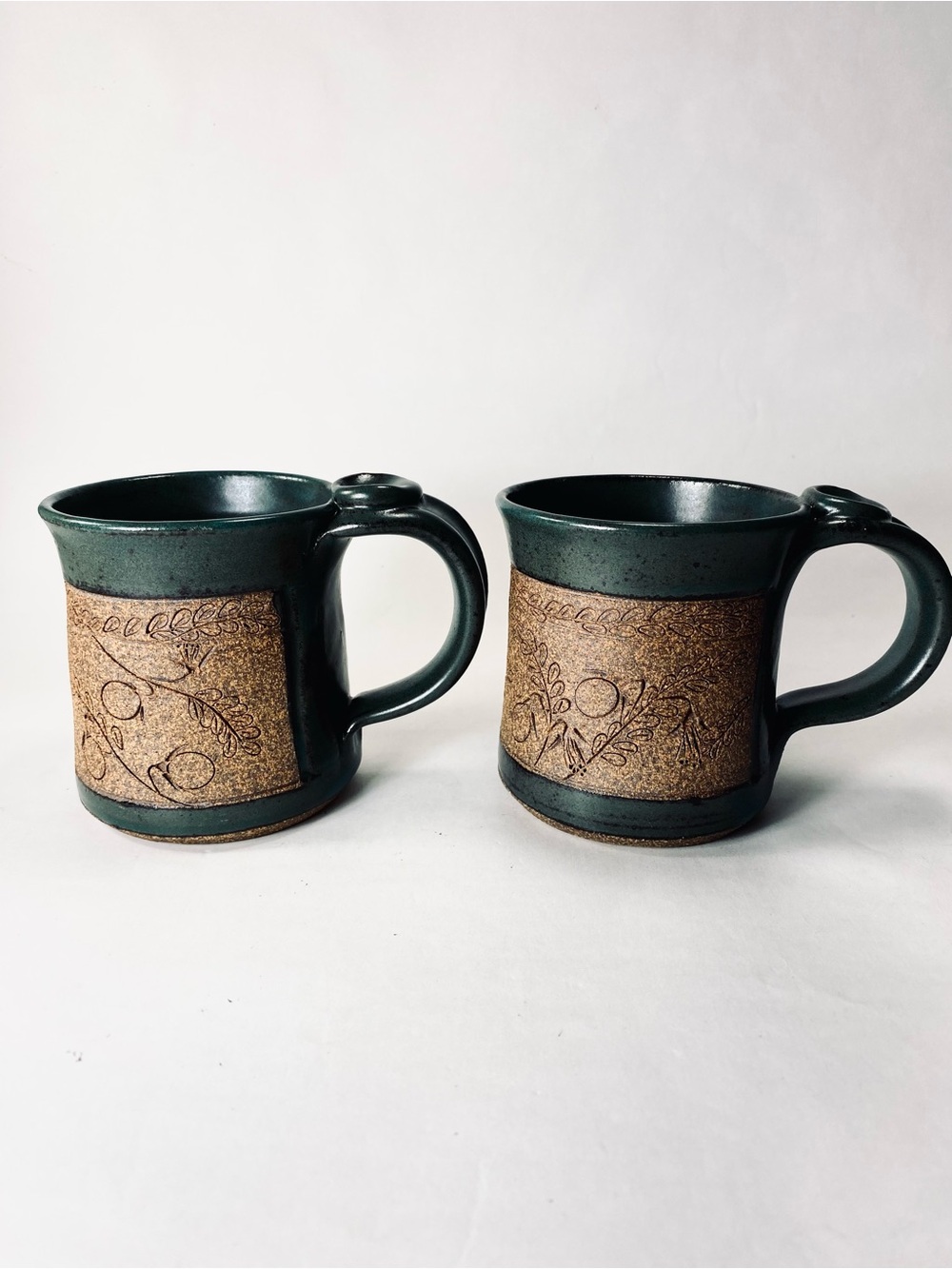 2 Handcrafted Pottery Mugs by Lynne Deep Teal Green Glaze Floral Etched Detail